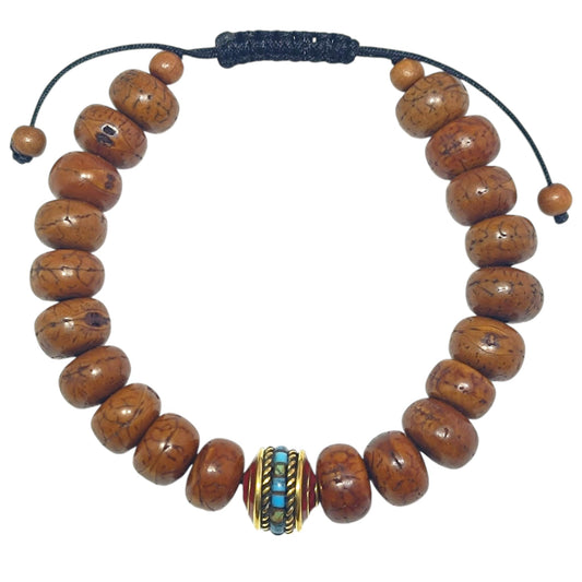 Pulsera Madera Coco Y Entrepieza Tibetana 12x7 mm Aprox (EL DIJE PUEDE LIGERAMENTE SER DIFERENTE) Ref:600404343-01