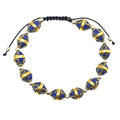 Pulsera Tibetana entrepieza 8mm (EL DIJE PUEDE LIGERAMENTE SER DIFERENTE) Ref:600404345-03