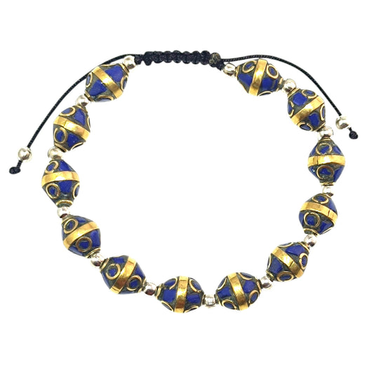 Pulsera Tibetana entrepieza 8mm (EL DIJE PUEDE LIGERAMENTE SER DIFERENTE) Ref:600404345-03